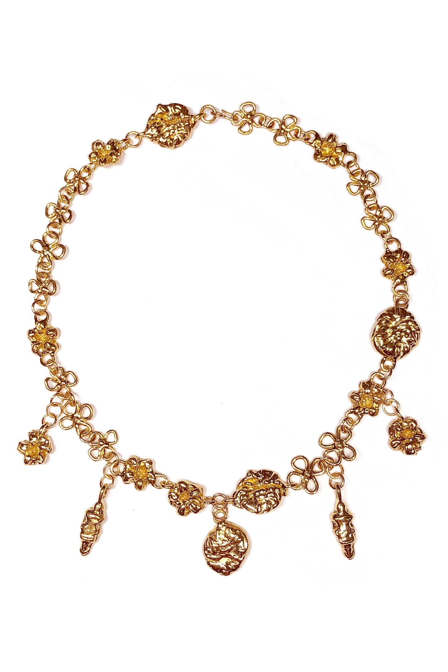 Product photo of Earthly Delight Necklace by CLARK in 18K Gold Vermeil. This unique luxury necklace features multiple gold charm talismans hanging from floral chain links, all handcraft using the lost wax casting method.