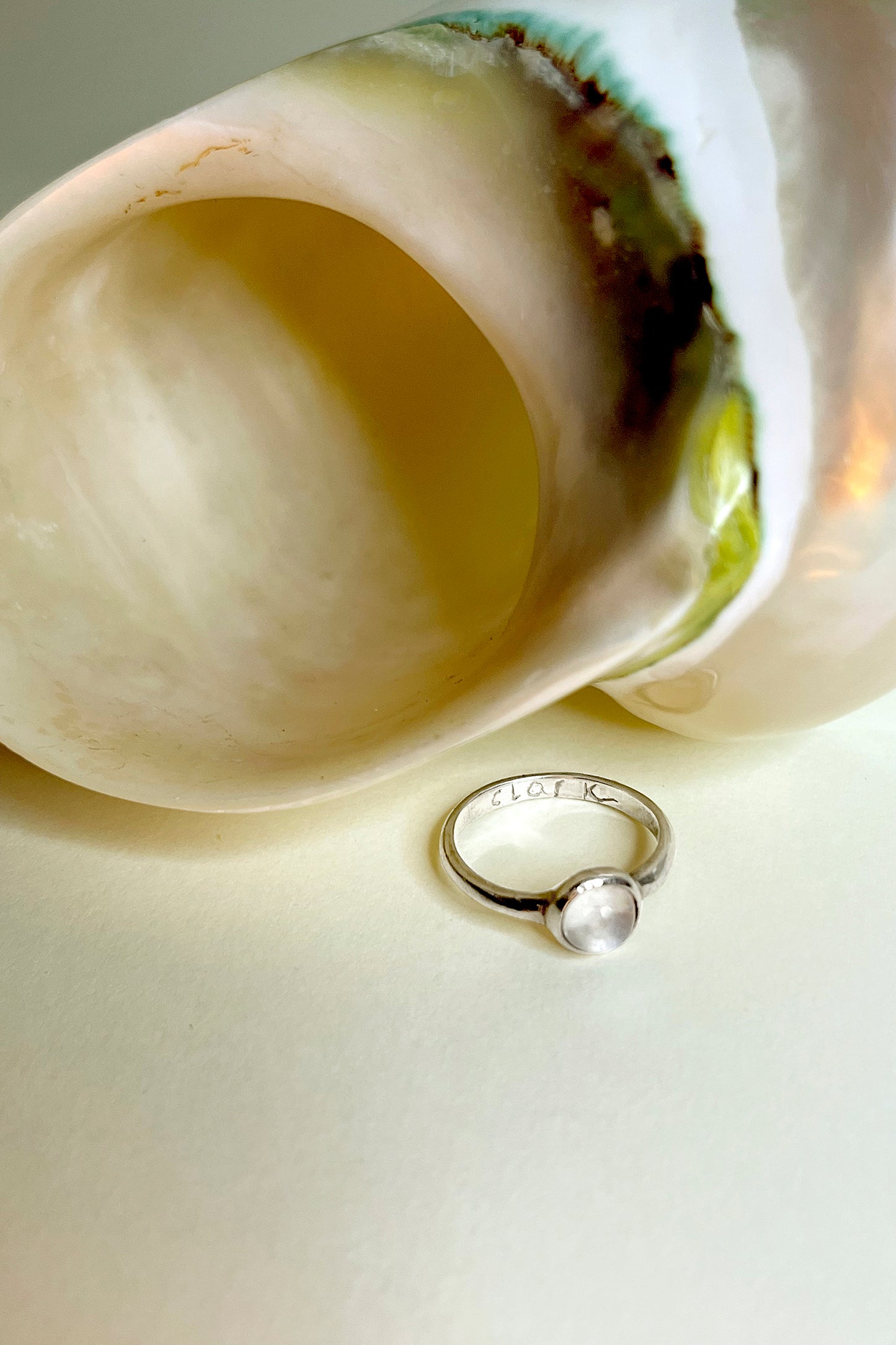 The Magic Mirror Moonstone Ring by CLARK with engraved band. Band says CLARK. Custom engraving is available for both Sterling Silver and 18k Gold Vermeil rings.