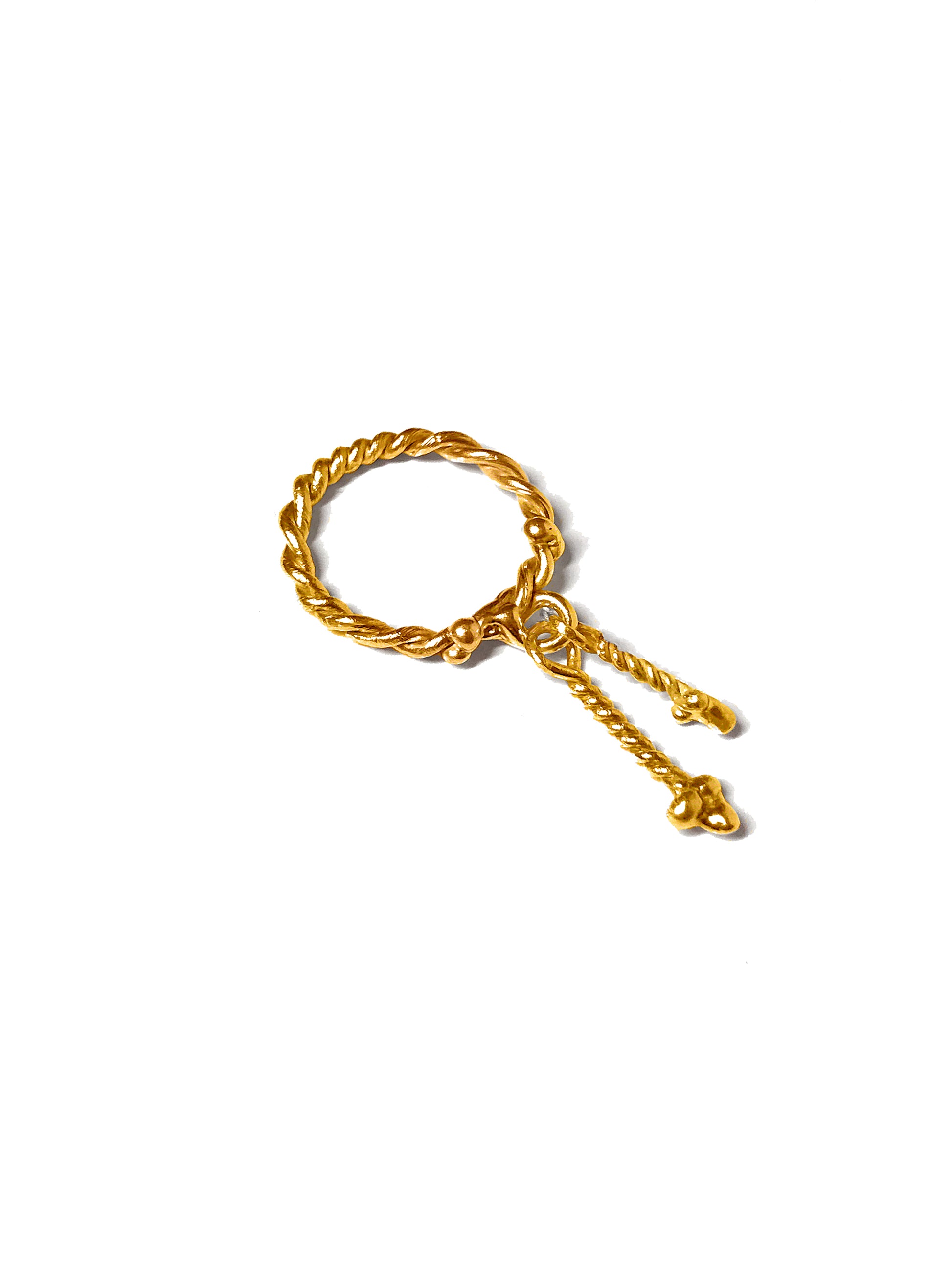 Product photo of Twisted Fates Charm ring in 18K Gold Vermeil laying flat. The unique hand-made details are clear from the two hanging charms to the twisted band. This statement ring is handcraft by an artist in Brooklyn making it a high quality and one-of-a-kind gift. 